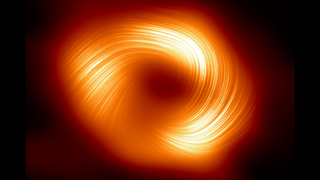 An orange ring with a swirl of light in it against a dark background